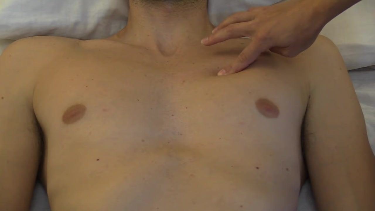 Examiner's fingers positioned in the second intercostal space, just left of the sternum
