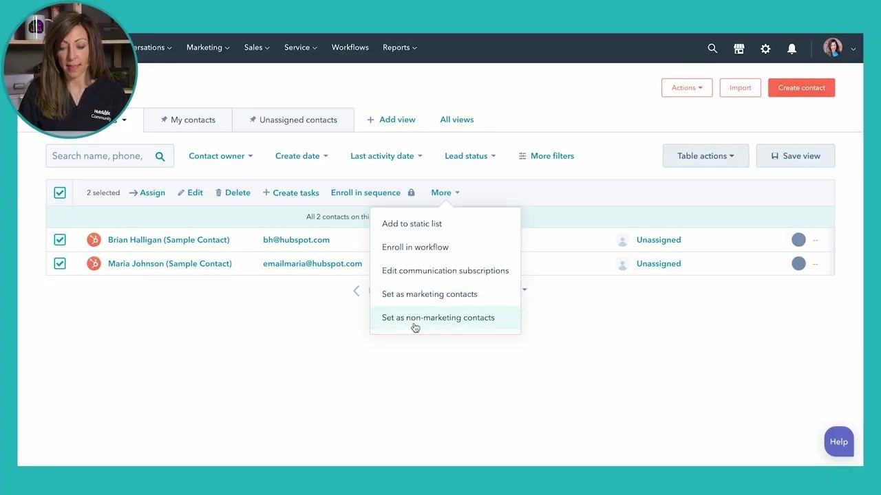HubSpot contact list with two contacts selected, the More dropdown open, and the Set as non-marketing contacts option highlighted. Brian Halligan and Maria Johnson appear as the selected contacts.