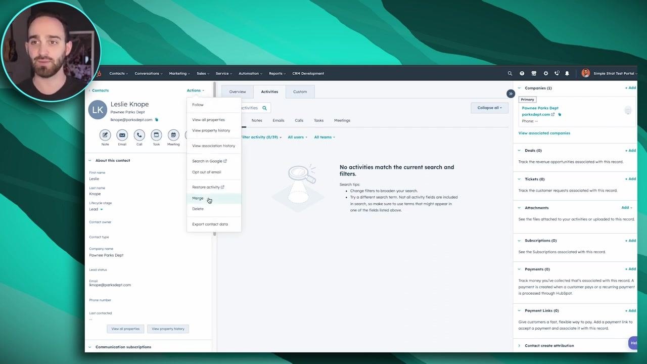 HubSpot contact record for Leslie Knope with the Actions menu open and the Merge option highlighted
