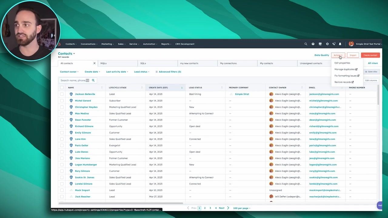 HubSpot Contacts table with the Actions dropdown open and the Manage duplicates option visible
