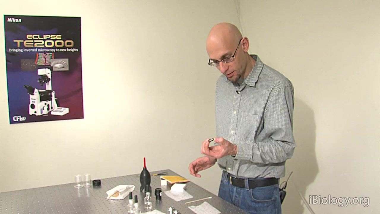 A person holds a mounted filter, explaining why the drag mopping technique does not work for this type.