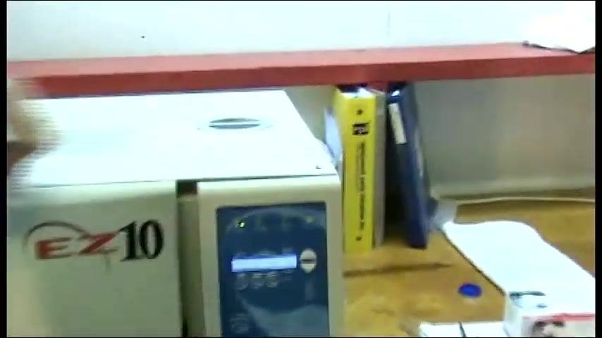 The autoclave closed and running, with the operator monitoring the process.