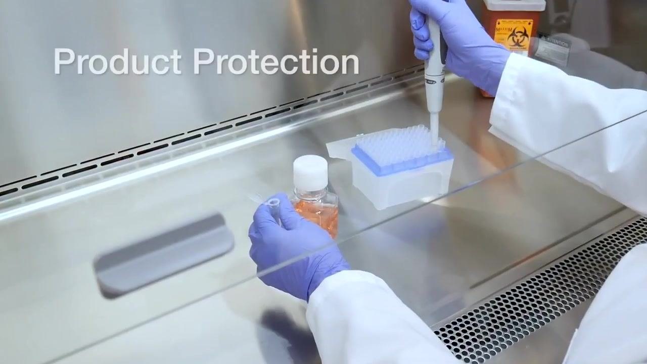 Text overlay reading "Product Protection" as a worker pipettes into a tip box, illustrating how airflow keeps products uncontaminated.