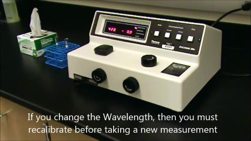 Spectrophotometer display showing 480 nm and 0.0 with a reminder to recalibrate after changing the wavelength
