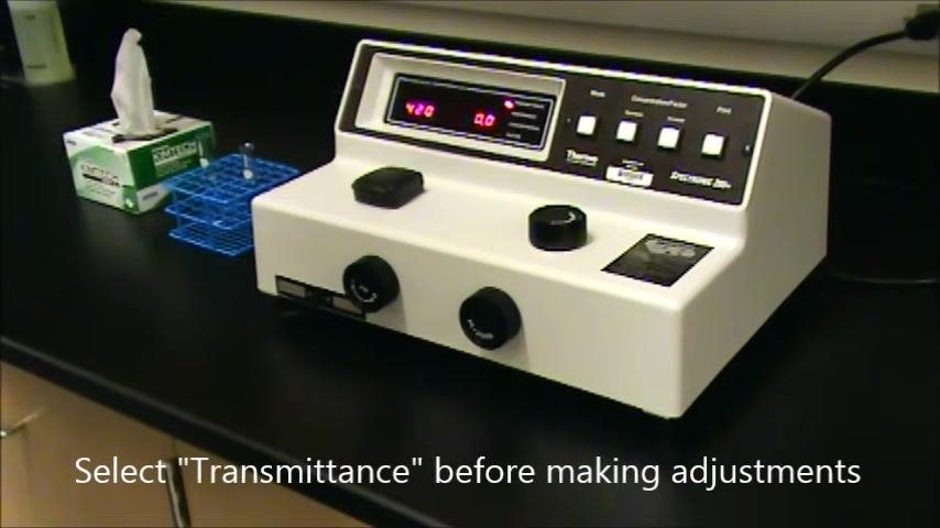 Spectrophotometer display instructing you to select Transmittance before making adjustments