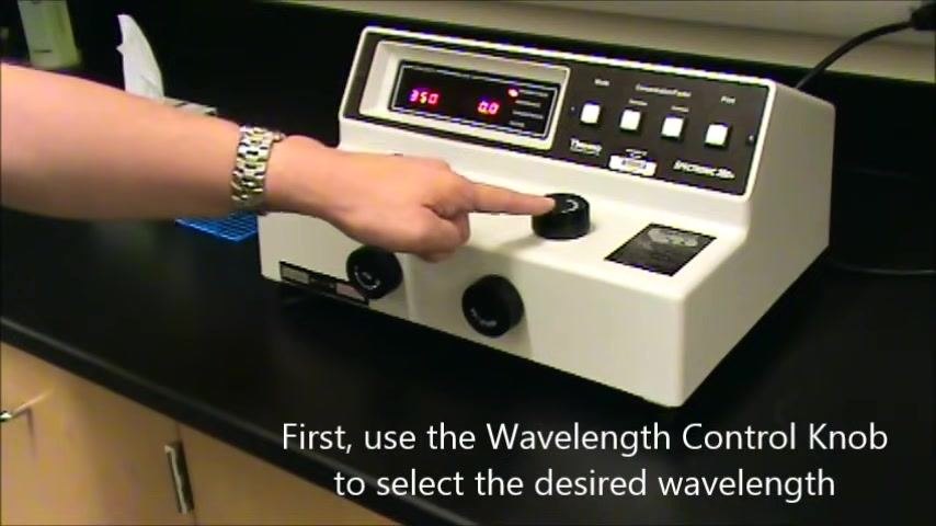 Hand adjusting the Wavelength Control Knob while the display shows 350 nm and 0.0