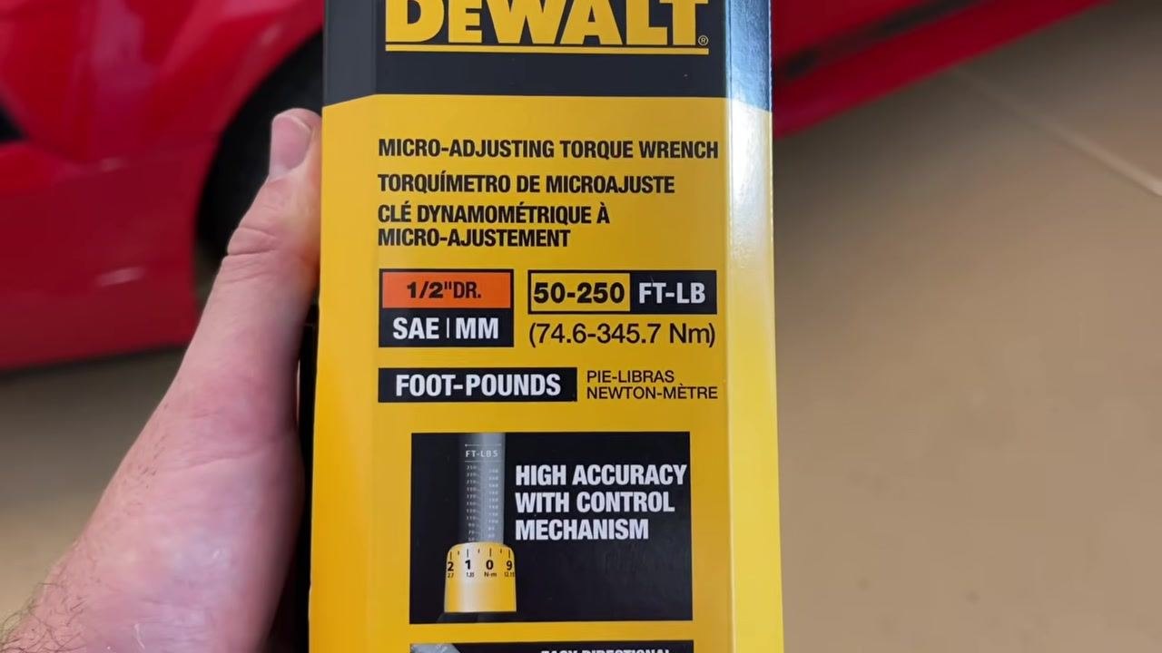 Front of the DeWalt torque wrench box showing the product name, torque range (50–250 ft-lb / 74.6–345.7 Nm), drive size (1/2" DR), and high-accuracy feature.