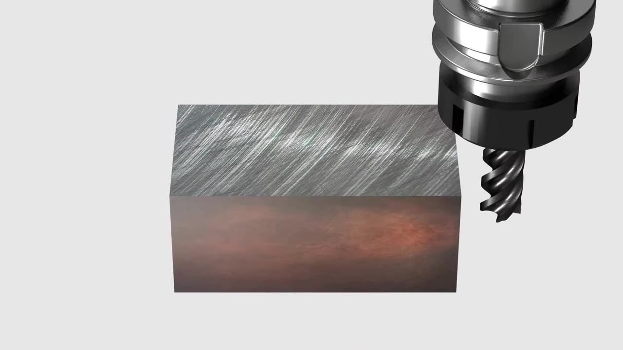 Rendered image showing an end mill approaching a metal block from above, emphasizing the cutting interface where overheating can occur.