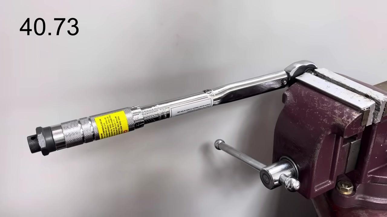 The torque wrench remains in the vice during ongoing testing at various points in its range.