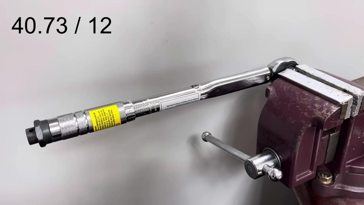 The imperial torque wrench is clamped in the vice. The calculation "40.73 / 12" is displayed.