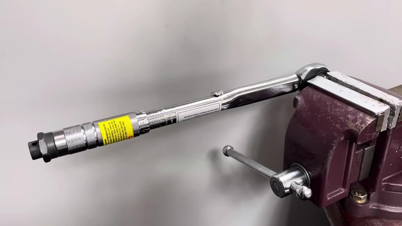 The torque wrench is clamped in the vice again, ready for further testing.