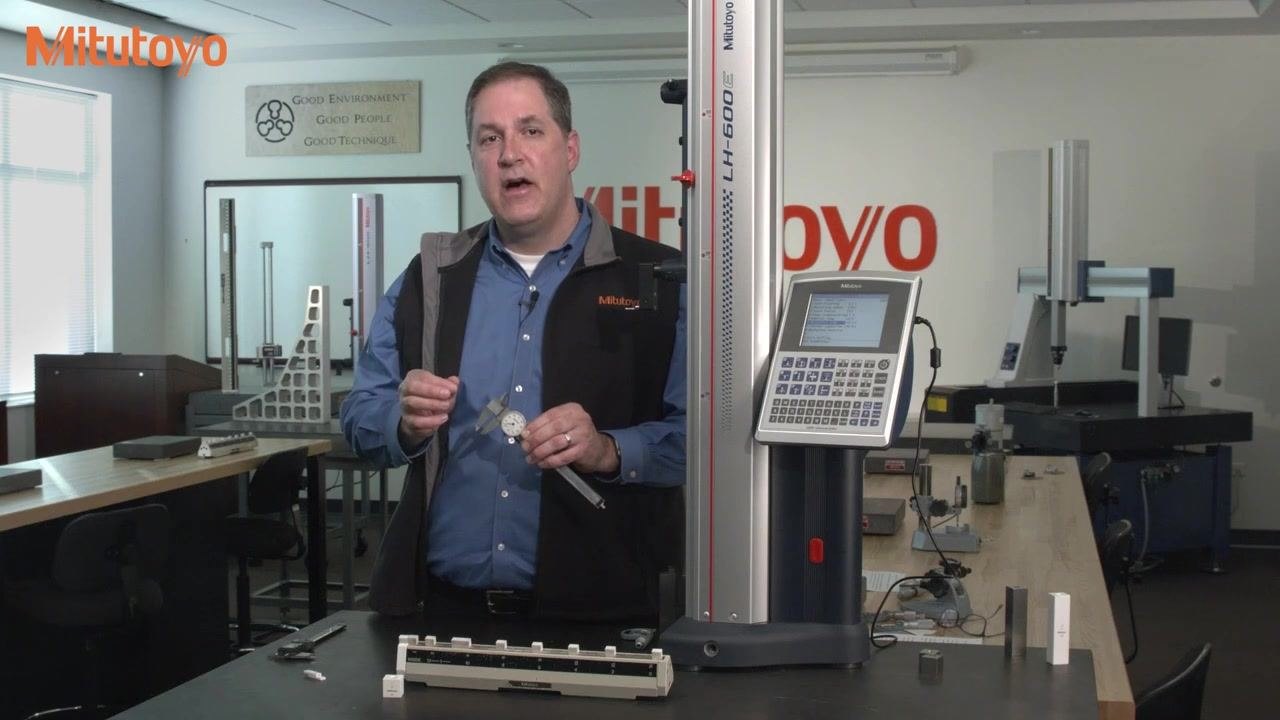 Measuring a 0.200-inch ring gauge with the inside jaws of a digital caliper; the calibration fixture is marked "INSIDE," with a 1-inch Mitutoyo gauge block and ring gauge visible