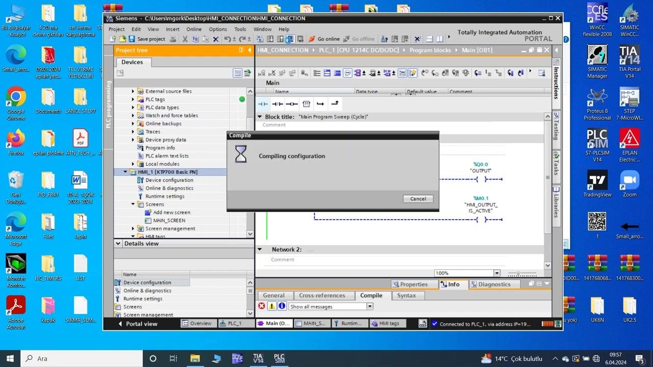 TIA Portal: compiling configuration dialog over the TIA Portal window, indicating the system is processing changes