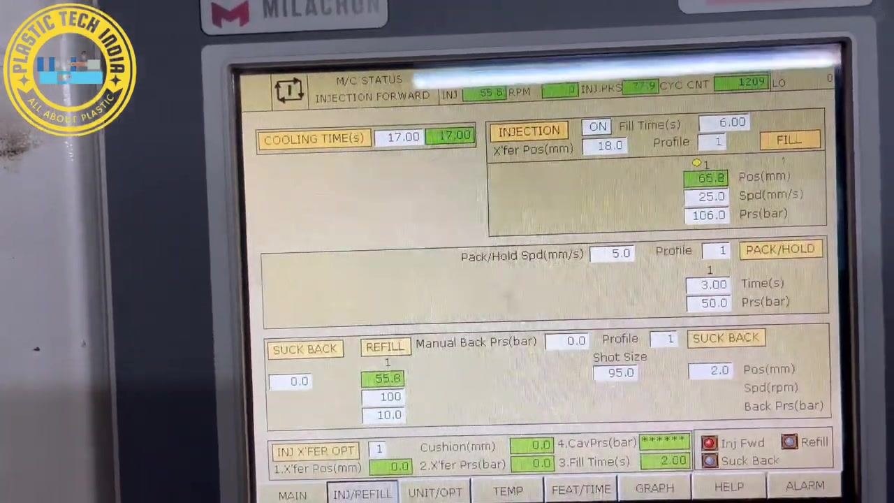 Control panel with 'Xfer Pos(mm): 15.0' highlighted, indicating the transfer position for the injection process.