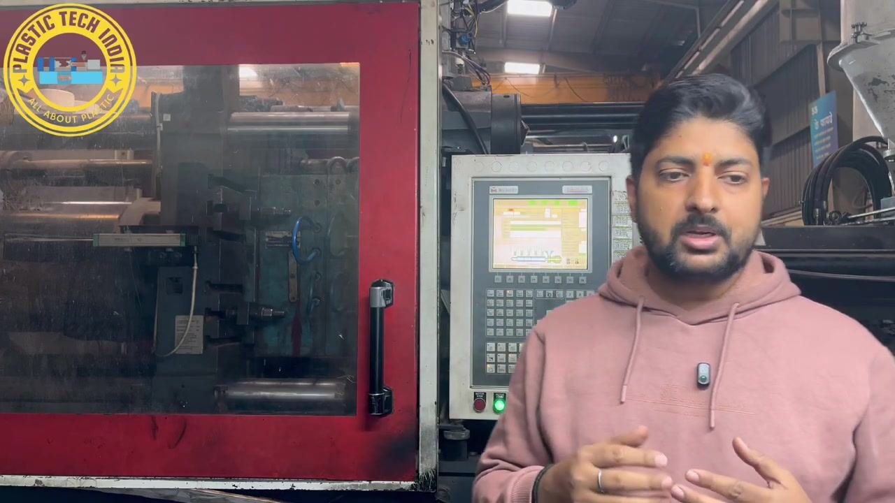Presenter instructing to first check the cushion, then the switch over position, standing in front of the machine and control panel.