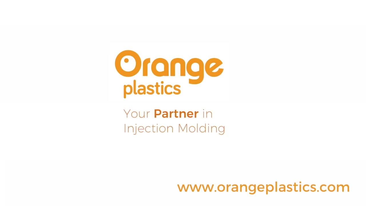 ENGEL injection molding machine with a conveyor leading to a box labeled "Orange plastics" in a warehouse