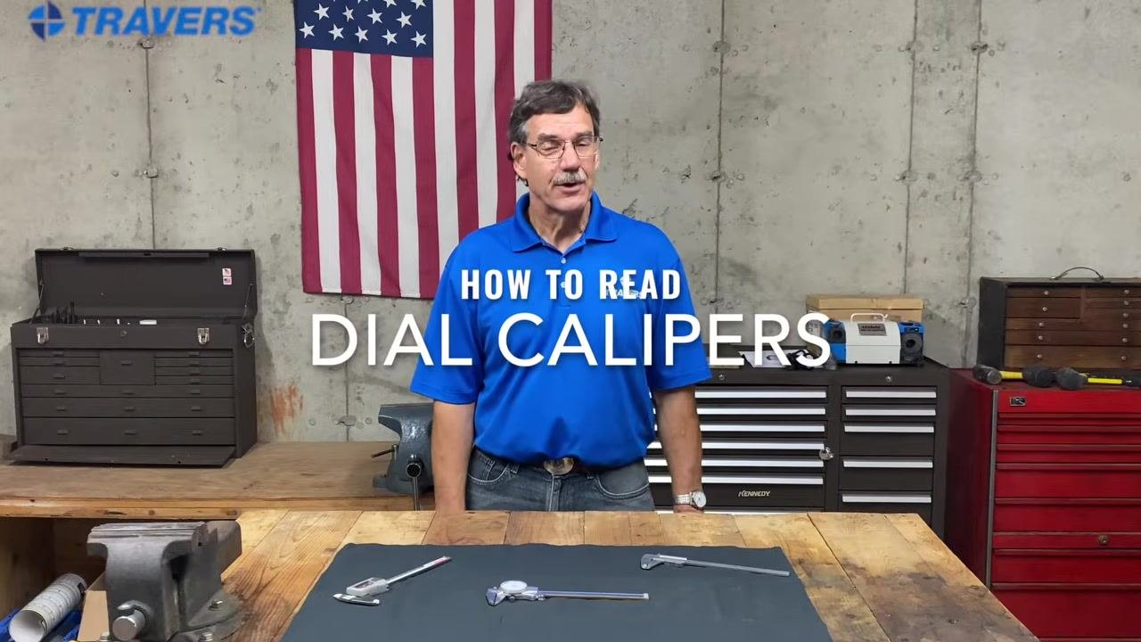 The presenter stands behind the workbench with calipers visible, reinforcing the focus on dial calipers.