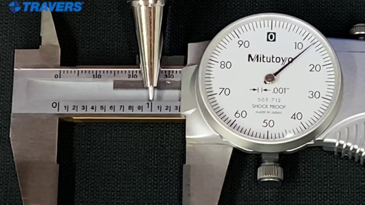 Pointer resting on the "1" of the main scale on a Mitutoyo dial caliper, with the dial face clearly visible.