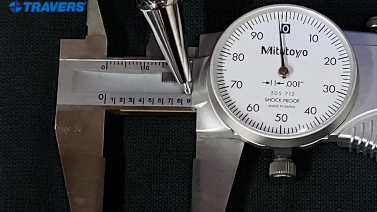 Pointer at "8" and the edge near "9" on the main scale, dial needle two ticks before zero, confirming 0.890 inches.