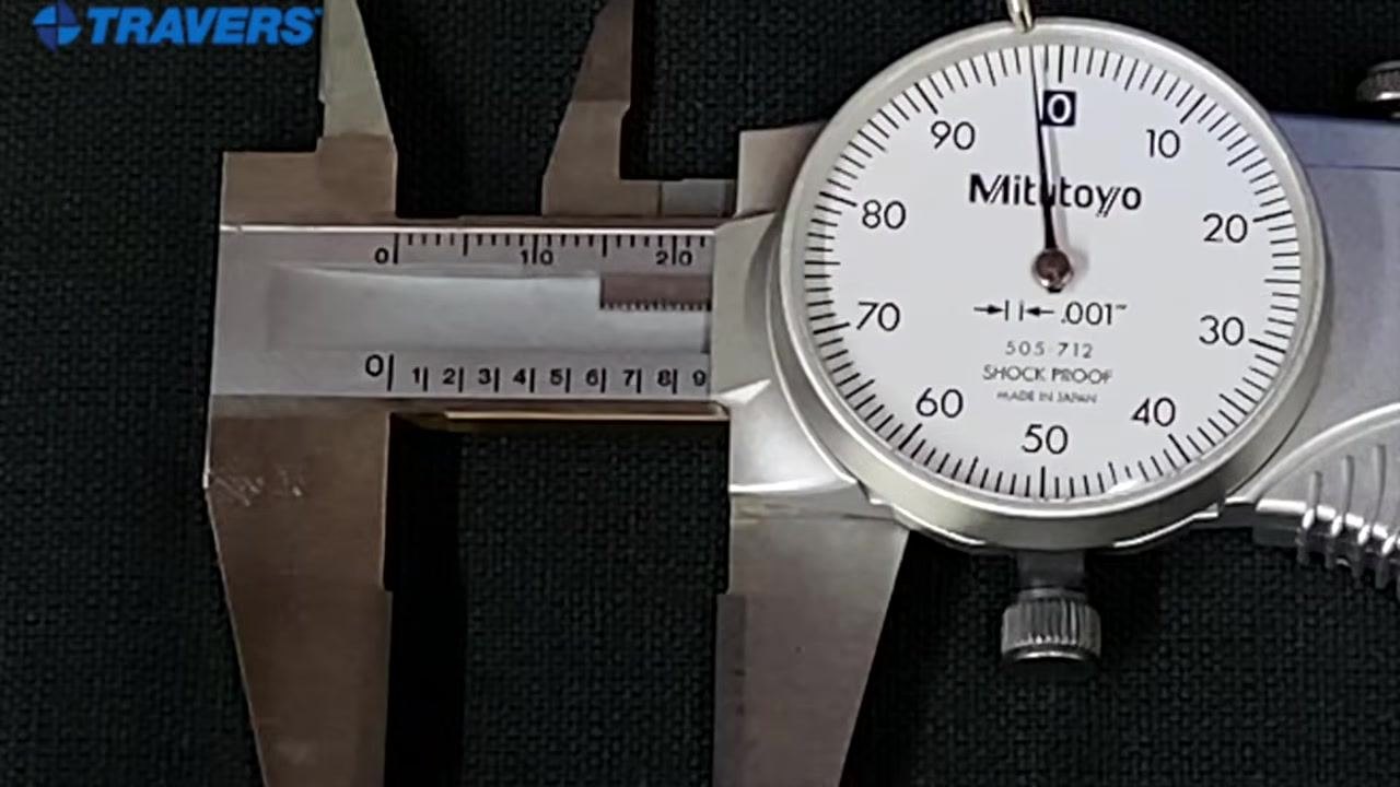 Mitutoyo dial caliper fully closed with both the main scale and dial reading zero.