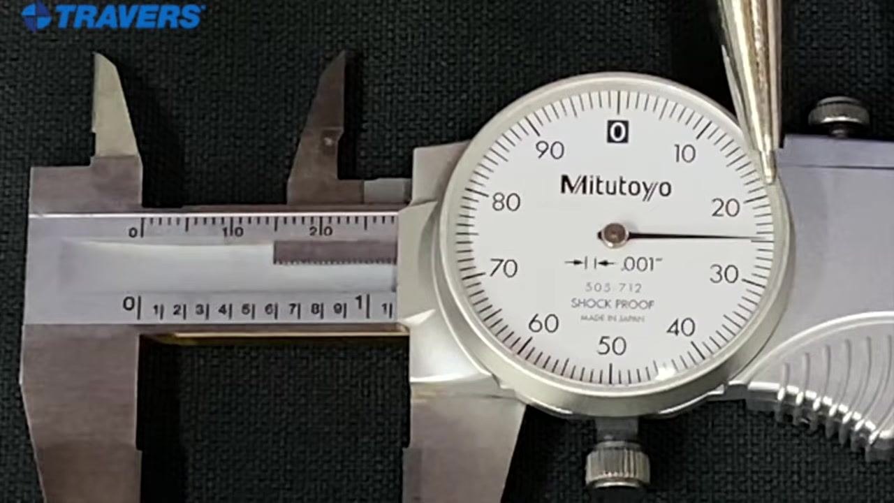 The pointer marks the "1" and the line after it on the main scale while the dial needle sits at 25, giving a reading of 1.125 inches.