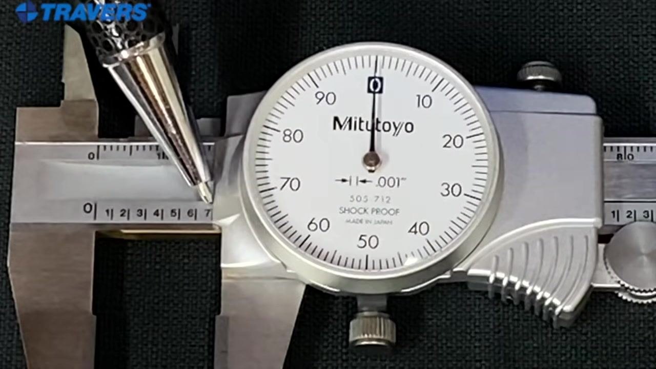 The pointer marks the line next to "7" on the main scale while the dial needle sits at zero, giving a reading of 0.700 inches.