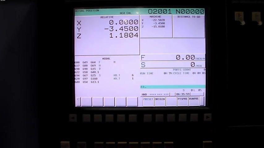 CNC control screen with X-axis zeroed at 0.0000, Y and Z values visible, confirming X-axis offset is set