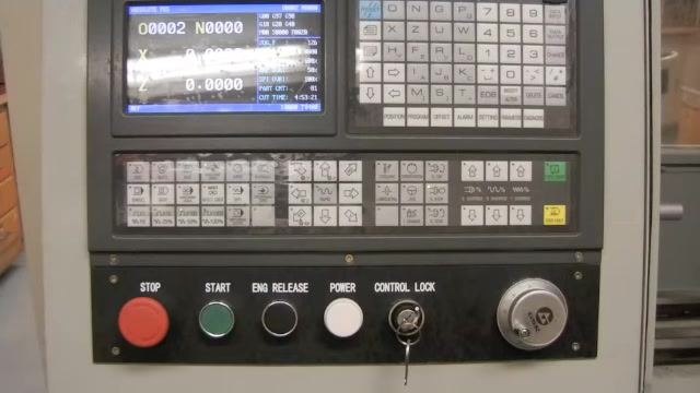 Operator using the depth rod of a dial caliper to measure and set the material length extending from the lathe chuck.