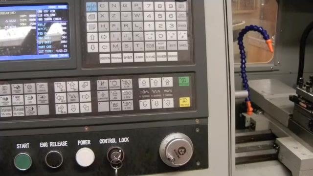 Operator pressing the Data Input button on the CNC controller to confirm the MDI command.