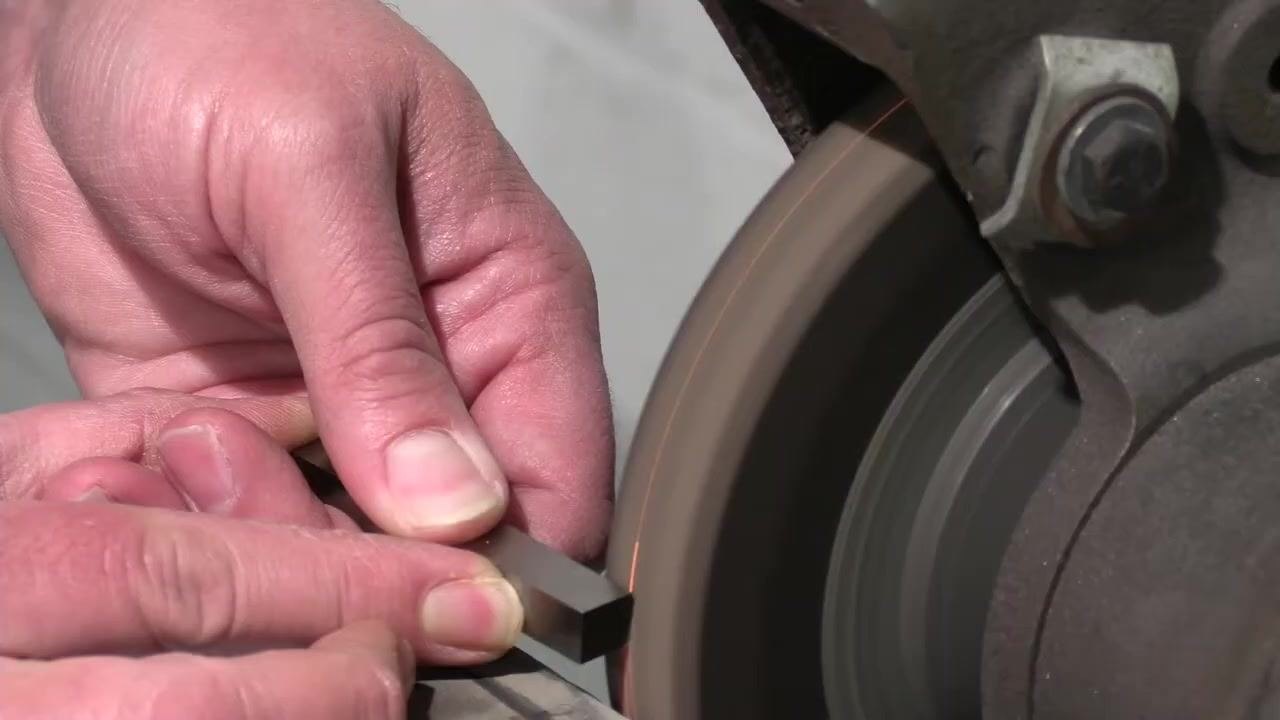 The tool rest and grinding wheel are shown with the tool bit removed for cooling.