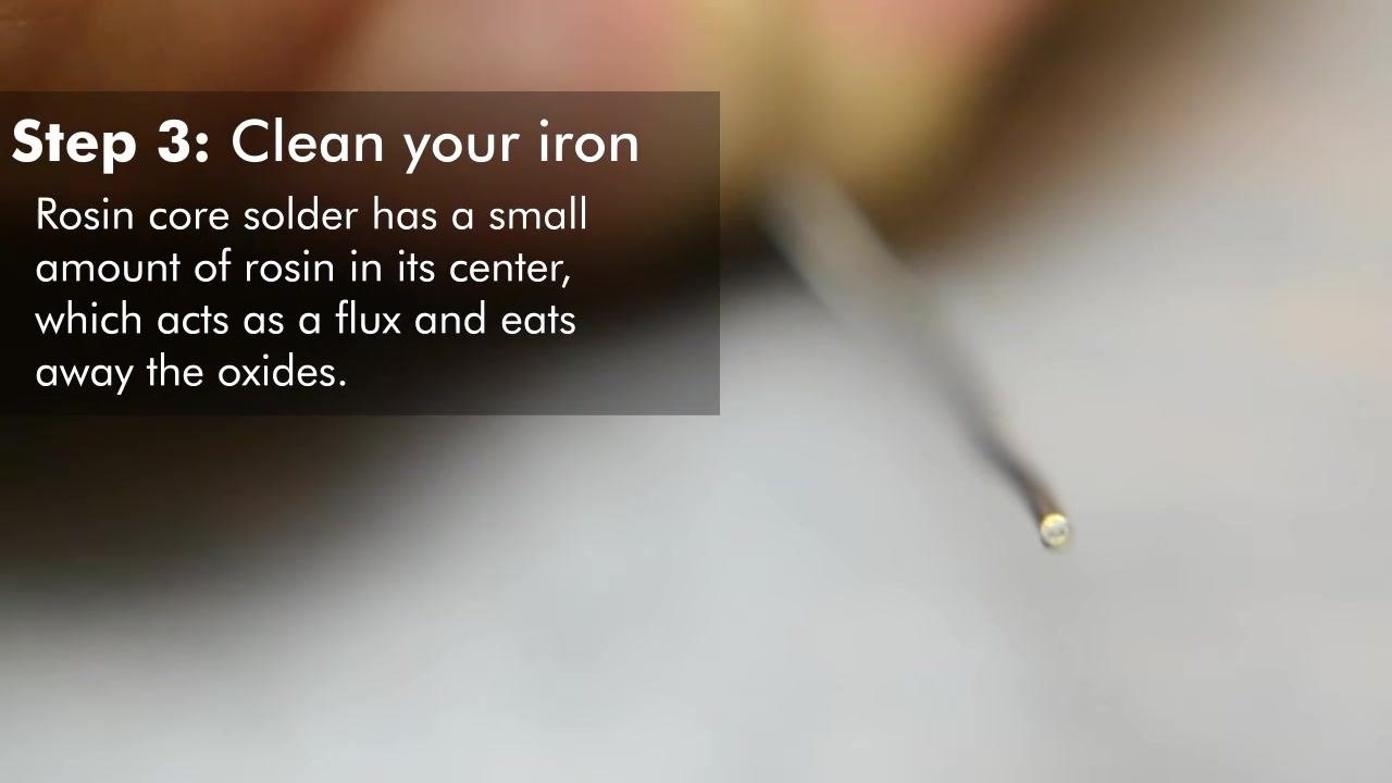Close-up of rosin core solder wire, with on-screen text: "Step 3: Clean your iron. Rosin core solder has a small amount of rosin in its center, which acts as a flux and eats away the oxides."