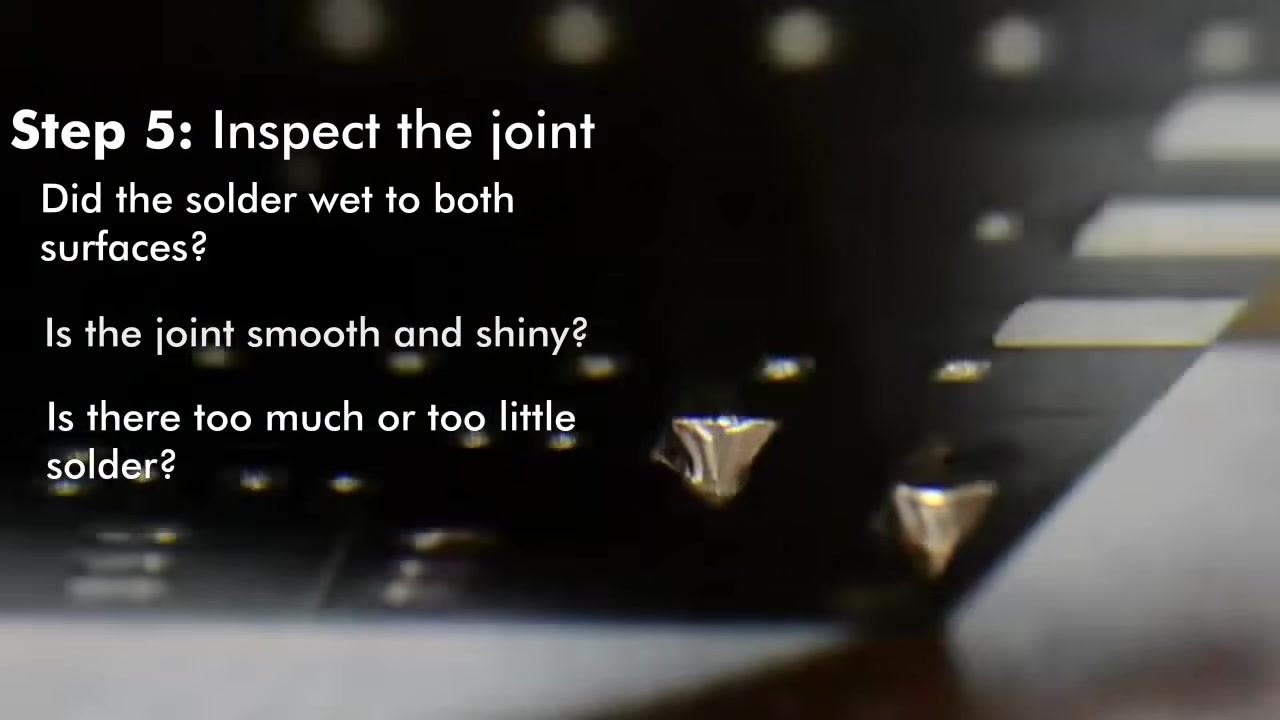 Soldering iron tip applied to a wire joint held by helping hands, with on-screen text: "Step 4: Apply heat and solder. Ensure good contact between the tip and the joint."