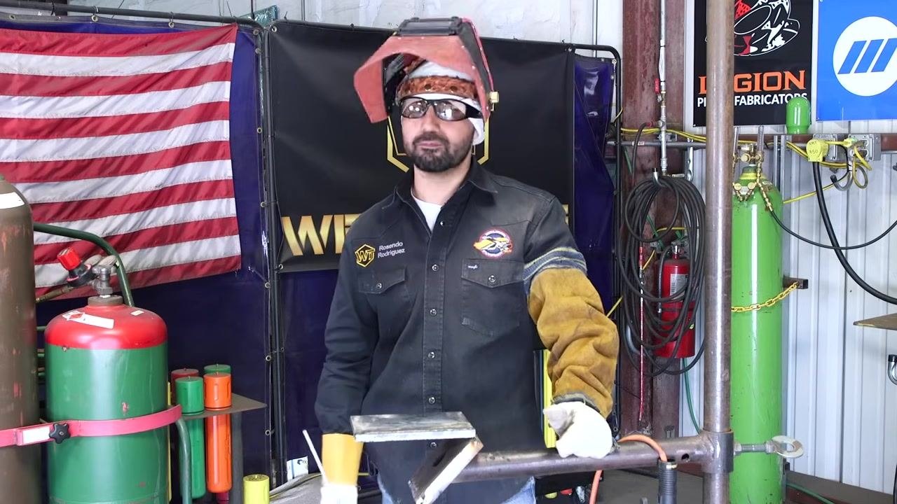 A welder stands ready at the plate, demonstrating the improved visibility of a shiny grind line.