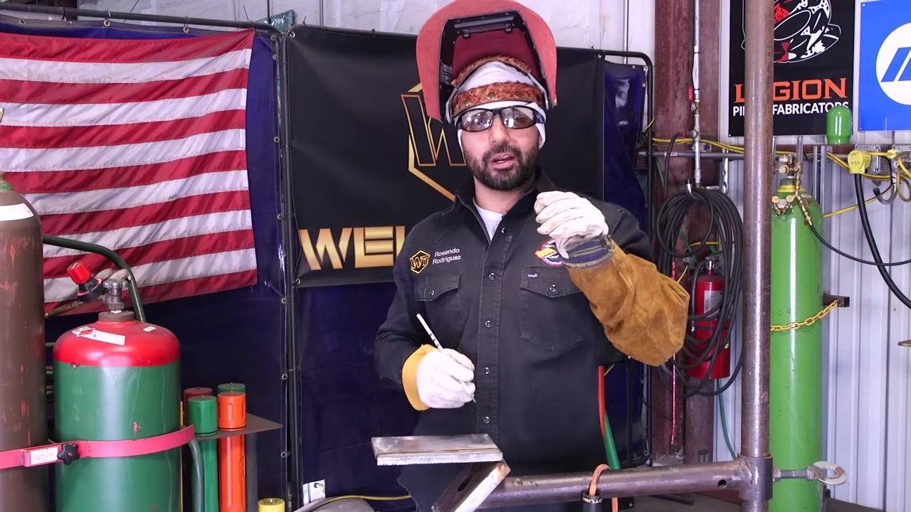 Hands demonstrate the technique for even metal feed through the plate.