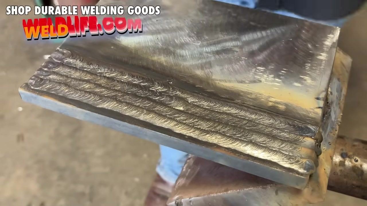 Instructor showing "10 TO 15 DEGREES" text, demonstrating the angle with the rod over the plate.