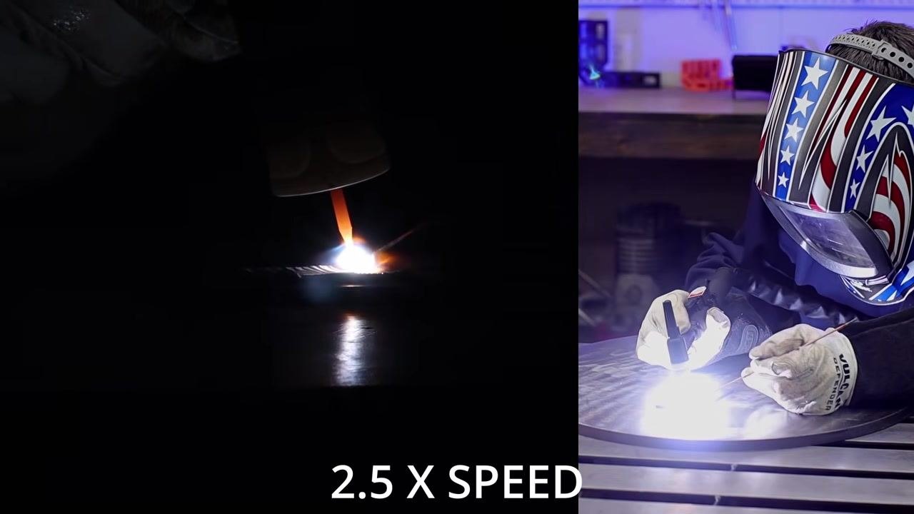 Split-screen view: a close-up of the TIG welding arc and filler rod in action on the left, and the welder wearing a patriotic helmet and gloves practicing on a metal table on the right, with "2.5 X SPEED" displayed at the bottom.