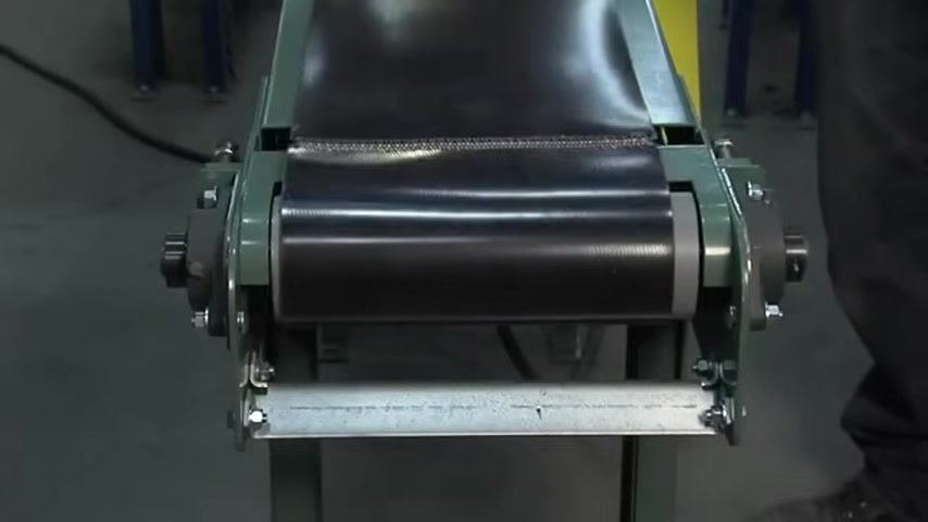 Conveyor belt running slightly off-center on the roller