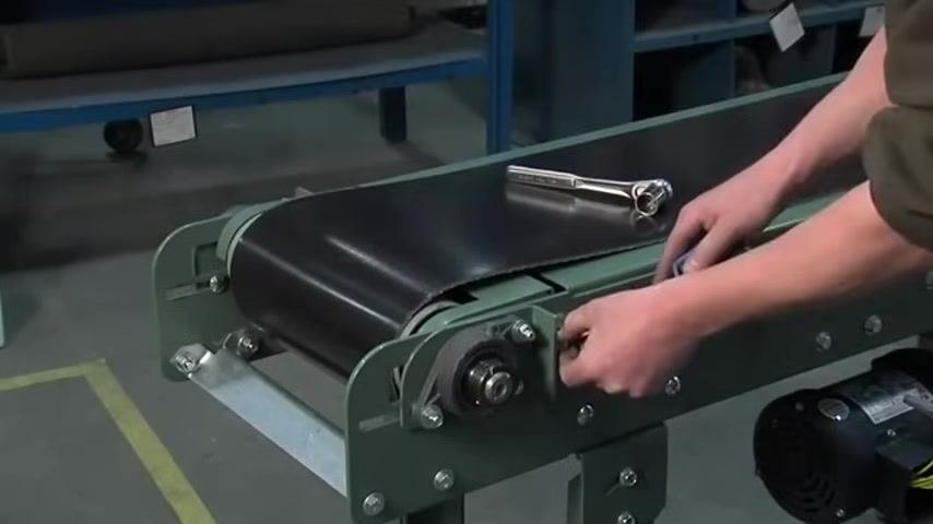 Adjusting the tension screw on the opposite side of the conveyor to match the first side