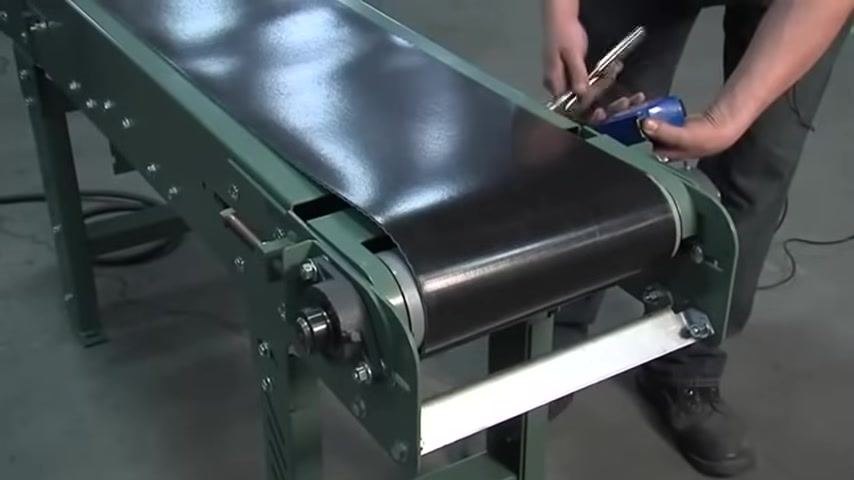 Checking and adjusting the tension screw while reading the tape measure