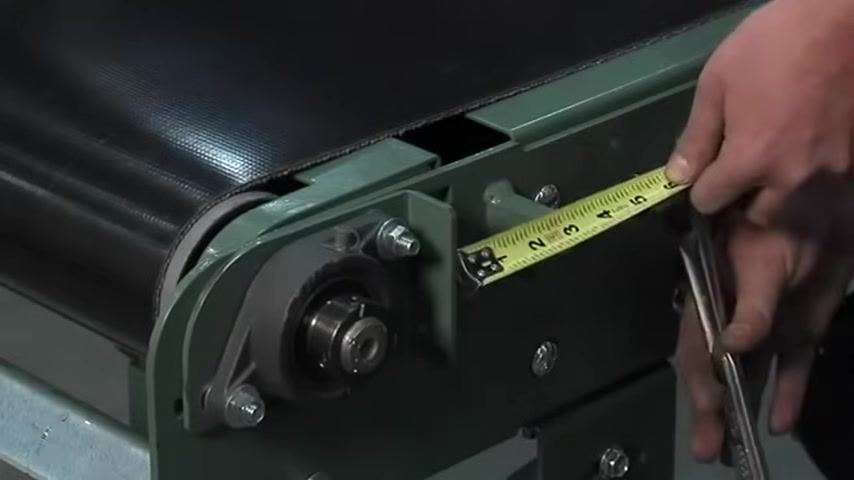 Adjusting the tension screw to reach the target measurement