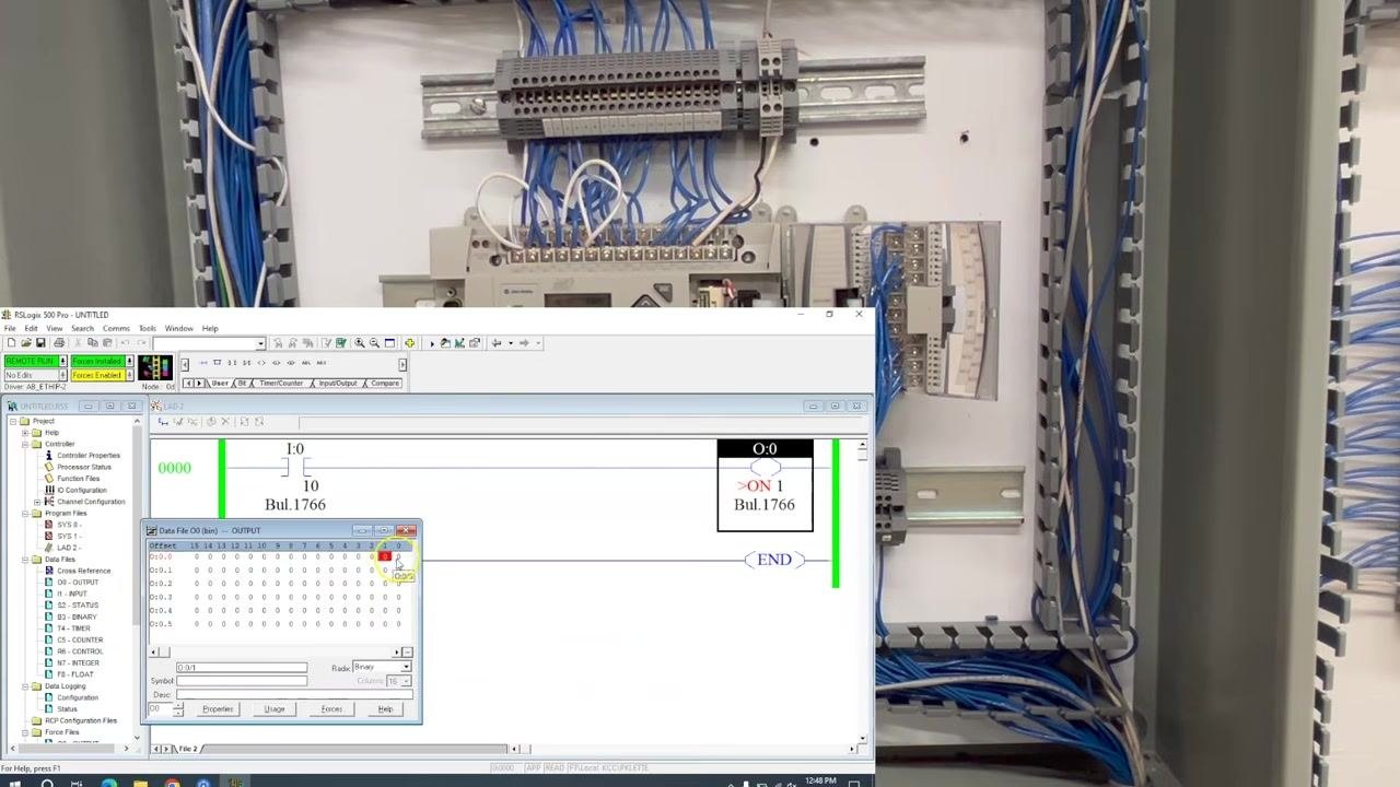 Probes trace the wiring, with the meter reading 0.0V and no schematic overlay.
