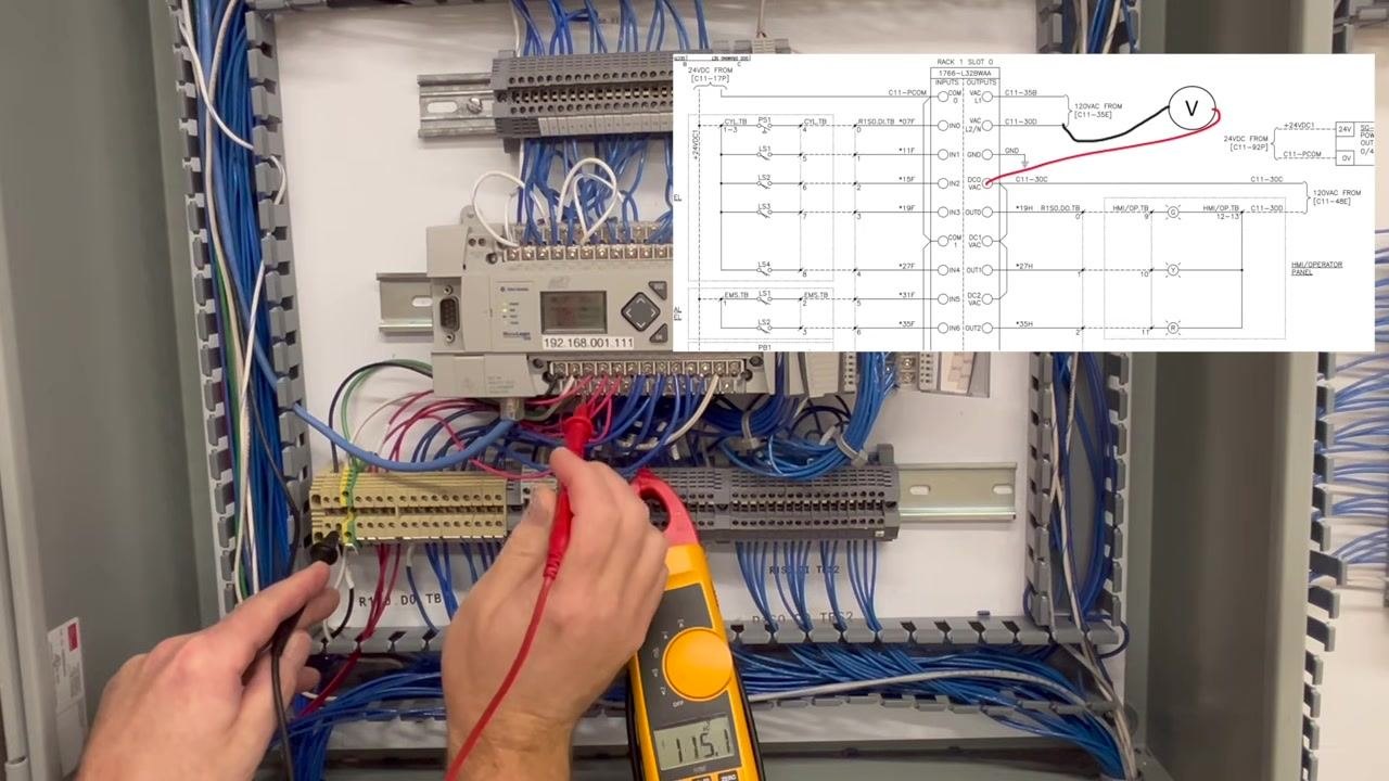 Only the black probe remains in place, with the meter reading 0.0V and no schematic overlay.