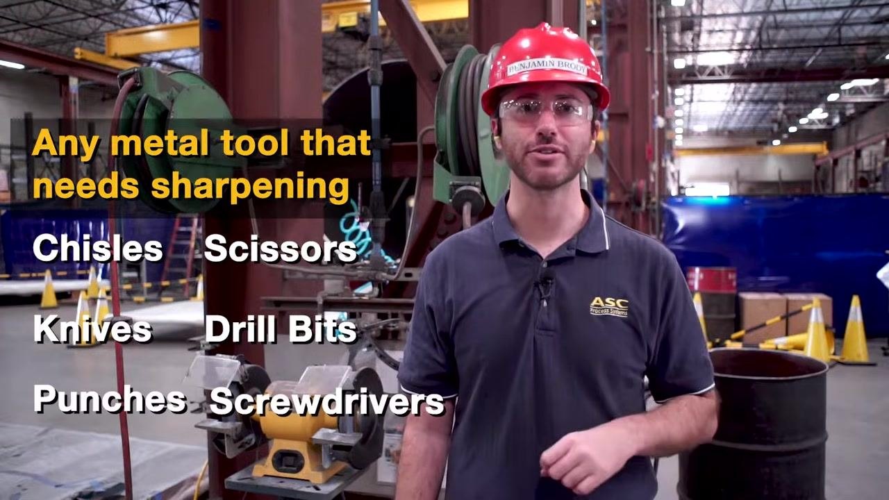 A bench grinder setup with on-screen text listing suitable tools: chisels, scissors, knives, drill bits, punches, and screwdrivers.