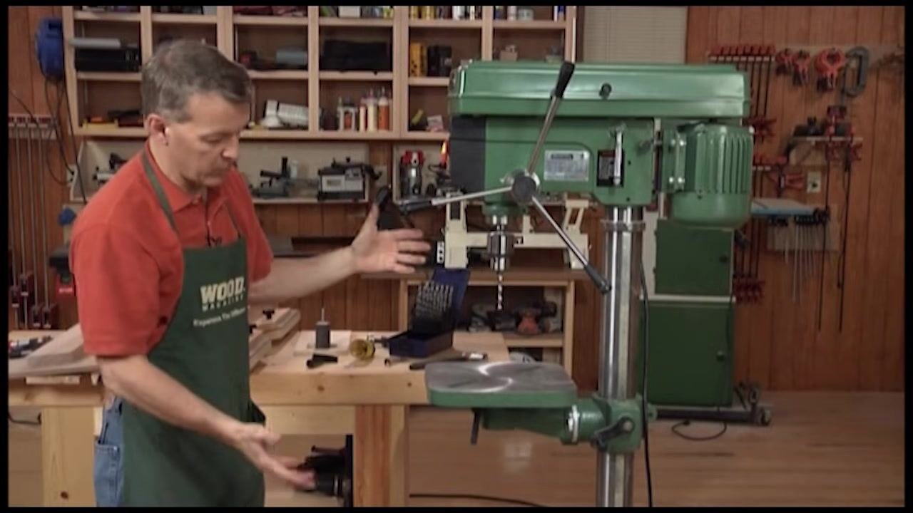 Full view of a floor-standing drill press, illustrating its base and overall structure