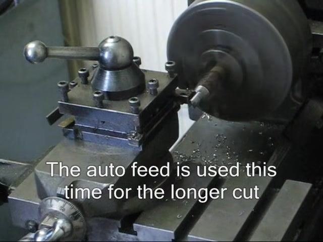 Lathe running with auto feed engaged for the longer cut along the workpiece.