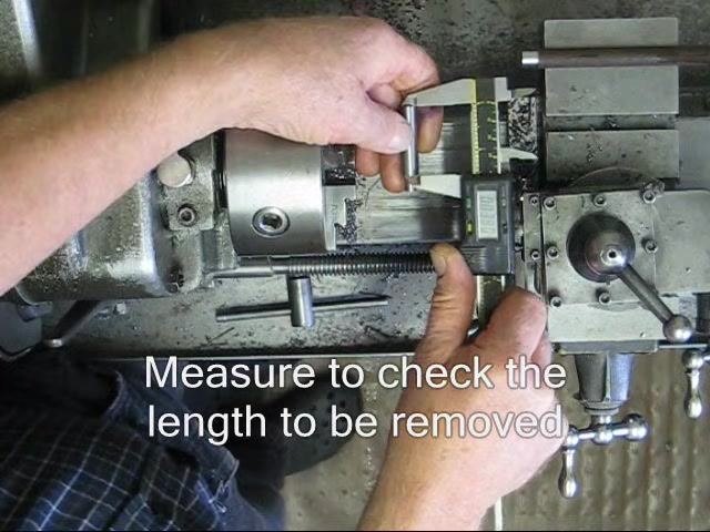 Cutting fluid being applied to the workpiece and parting tool.