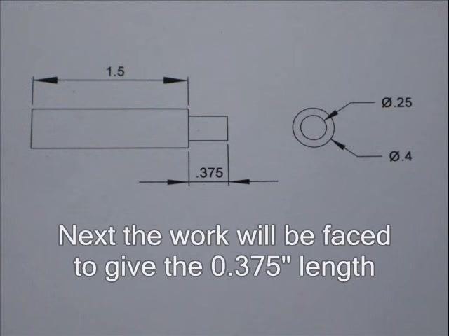 Lathe engaged in the final cut, with the cutting tool contacting the spinning workpiece.
