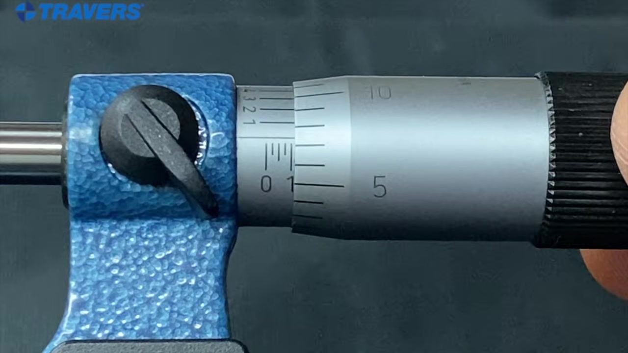 Micrometer with the "1" mark fully visible on the sleeve and the "10" on the thimble aligned with the reference line, indicating 0.110 inches.