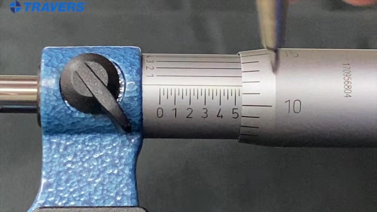 Micrometer with the "5" mark on the sleeve and the "10" on the thimble aligned, indicating 0.510 inches.