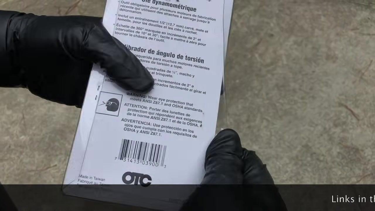 Gloved hand holding the back of the OTC 4554 package, displaying safety warnings, barcode, and manufacturing details